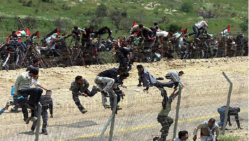 nakba day climbing fence.JPG